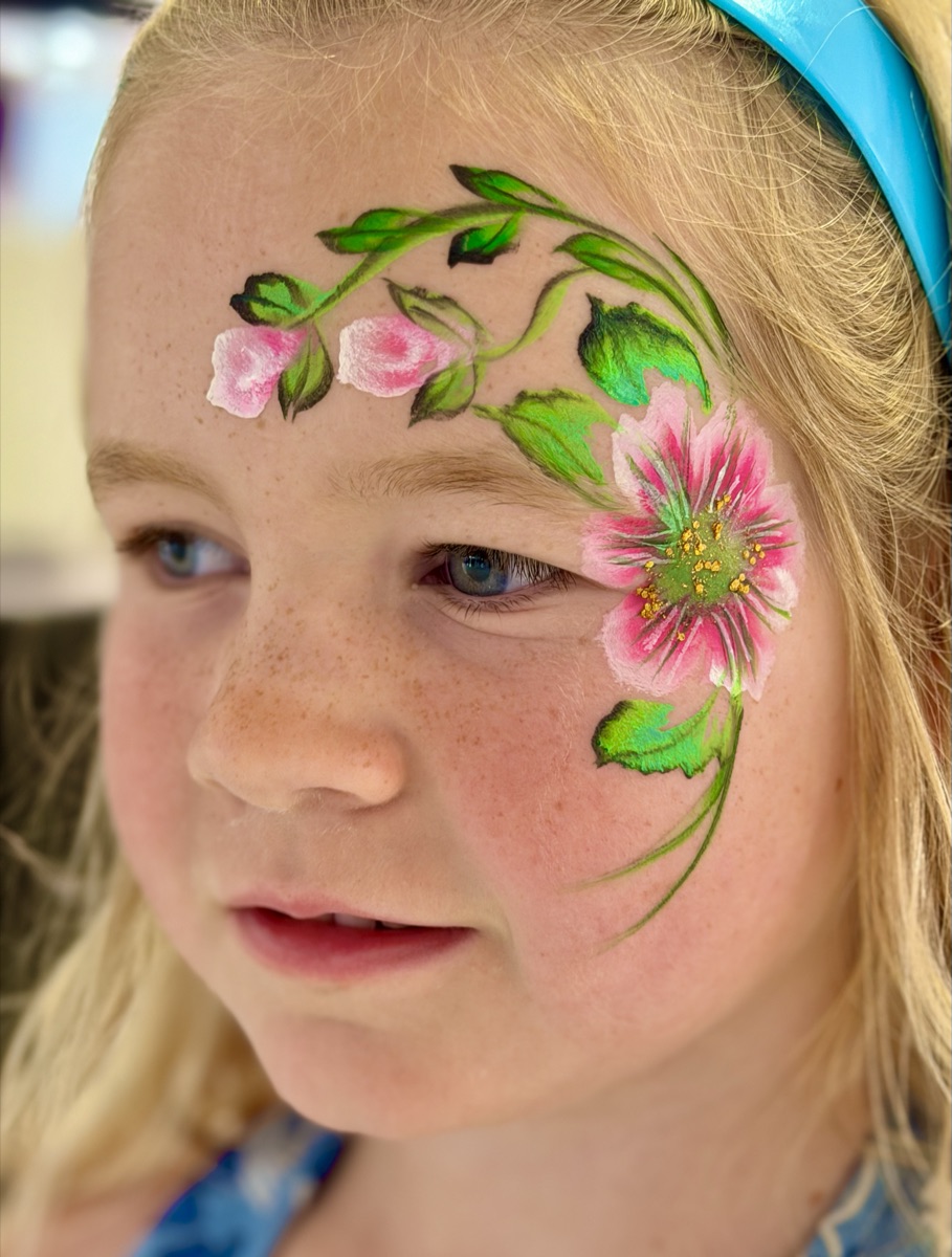 Detailed pink flower with green vines