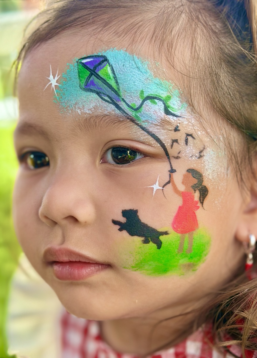 Girl flying a kite with her dog, storybook scene