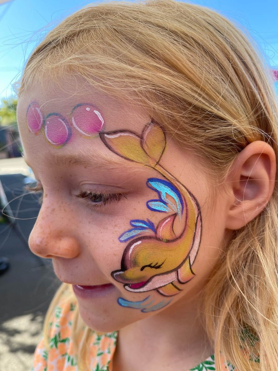 Yellow dolphin with pink bubbles