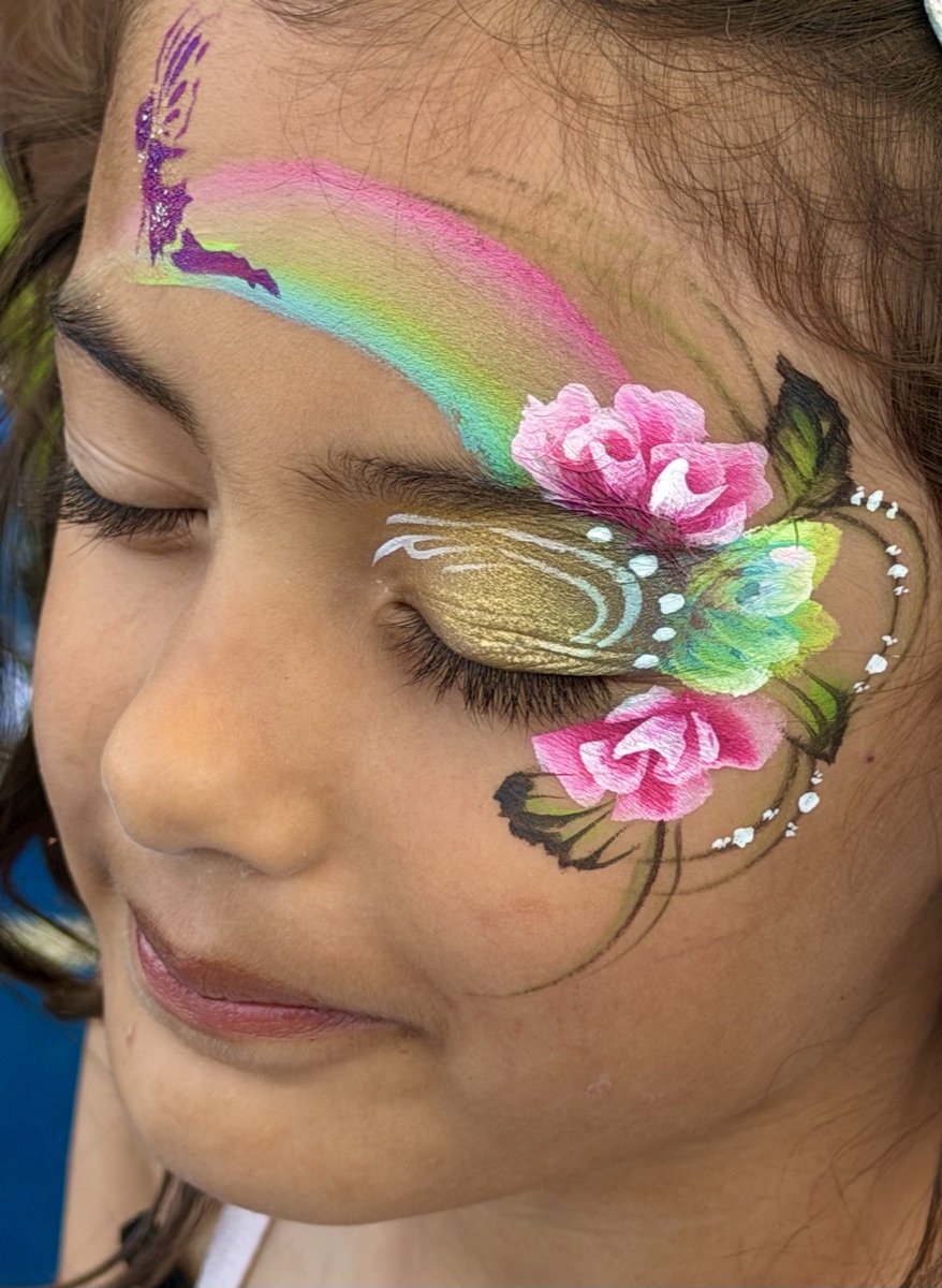 Fairy silhouette with rainbow and roses design, eyes closed